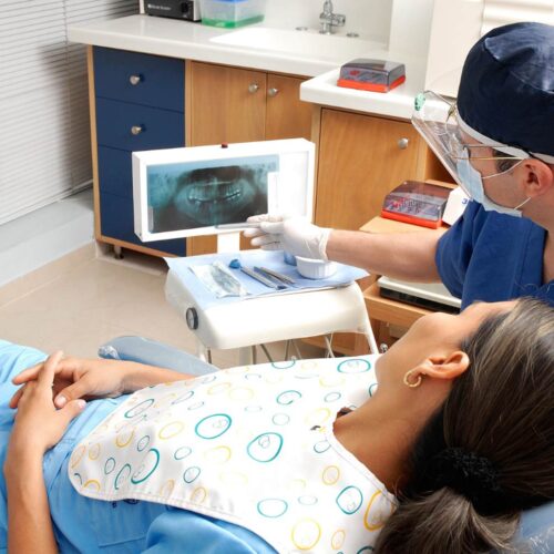 Dental hygienist with patient