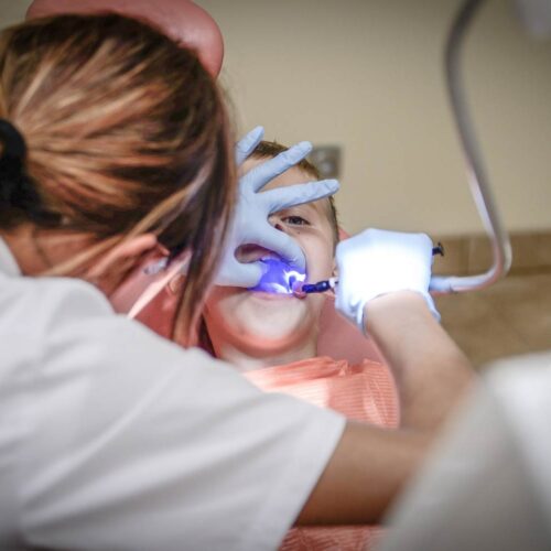 Dental hygienist with patient